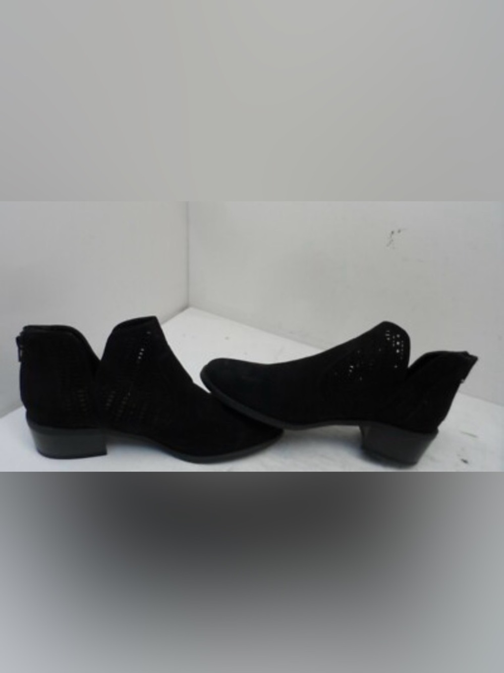 These are New Directions Women's Lida Perforated Ankle Booties in black. 8.5